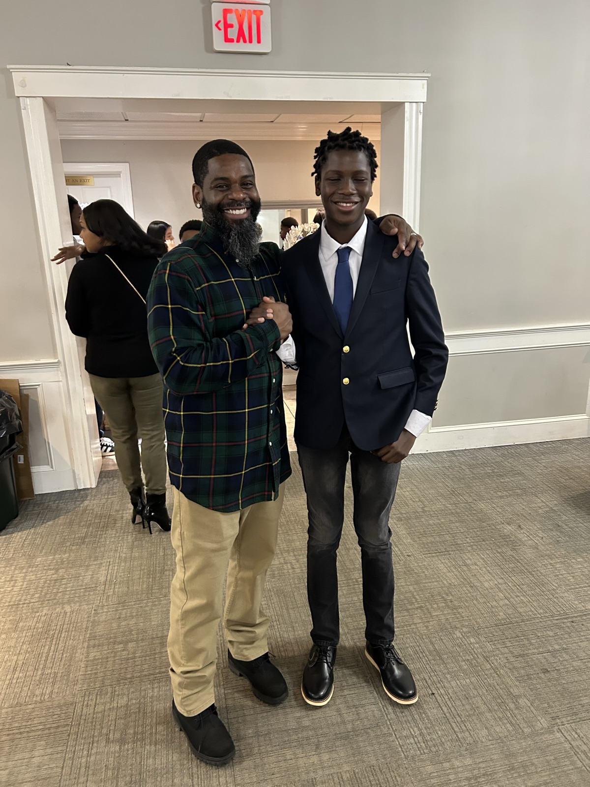 A mentor and student celebrating together at a recognition event